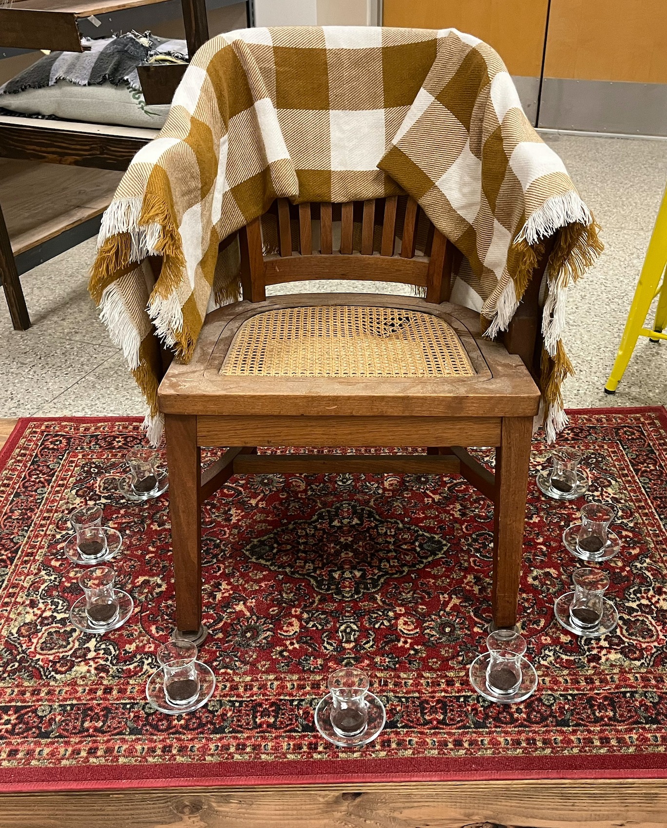 Chair installation with blanket and tea glasses