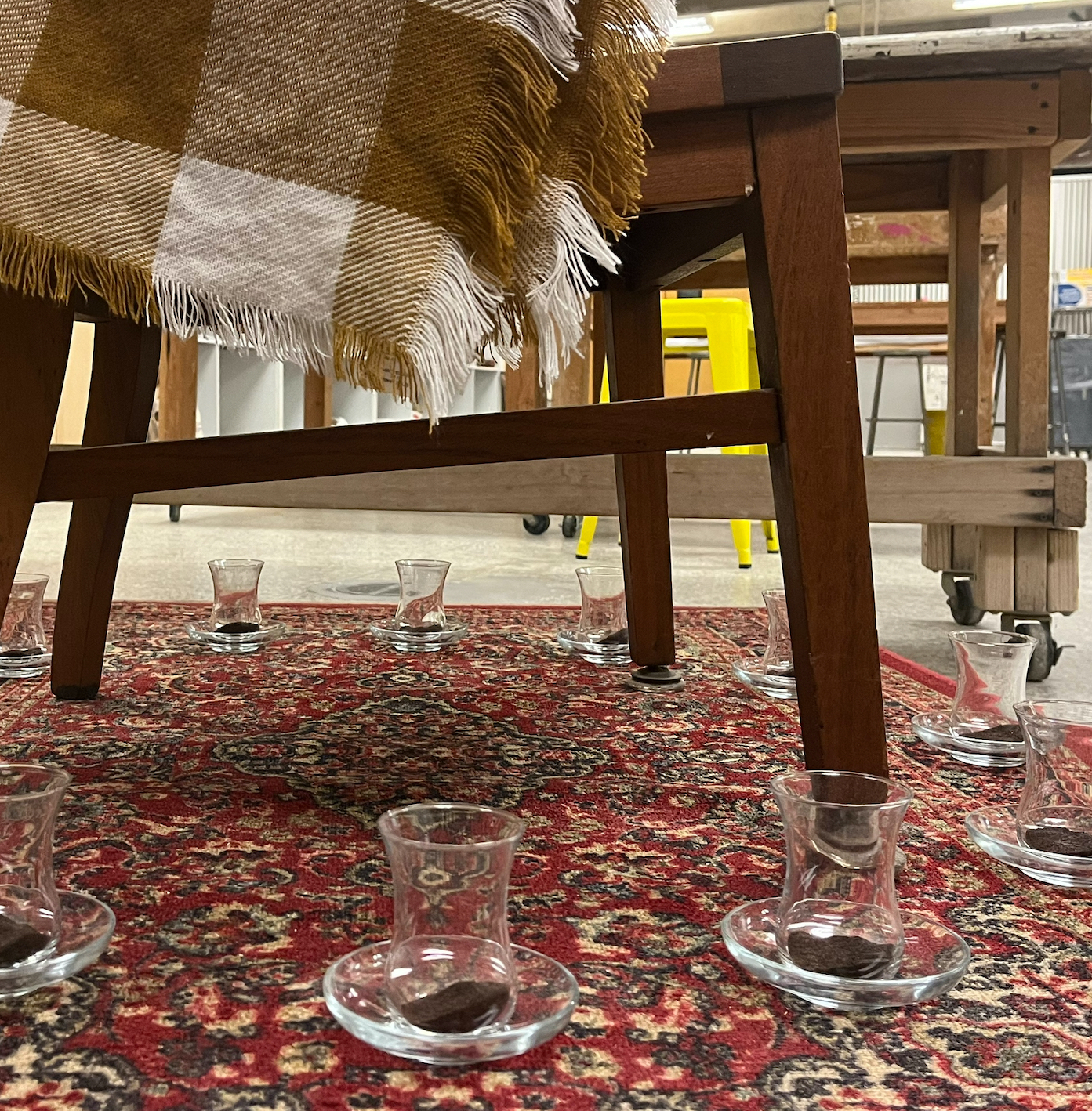 Installation with Turkish tea glasses on Persian rug